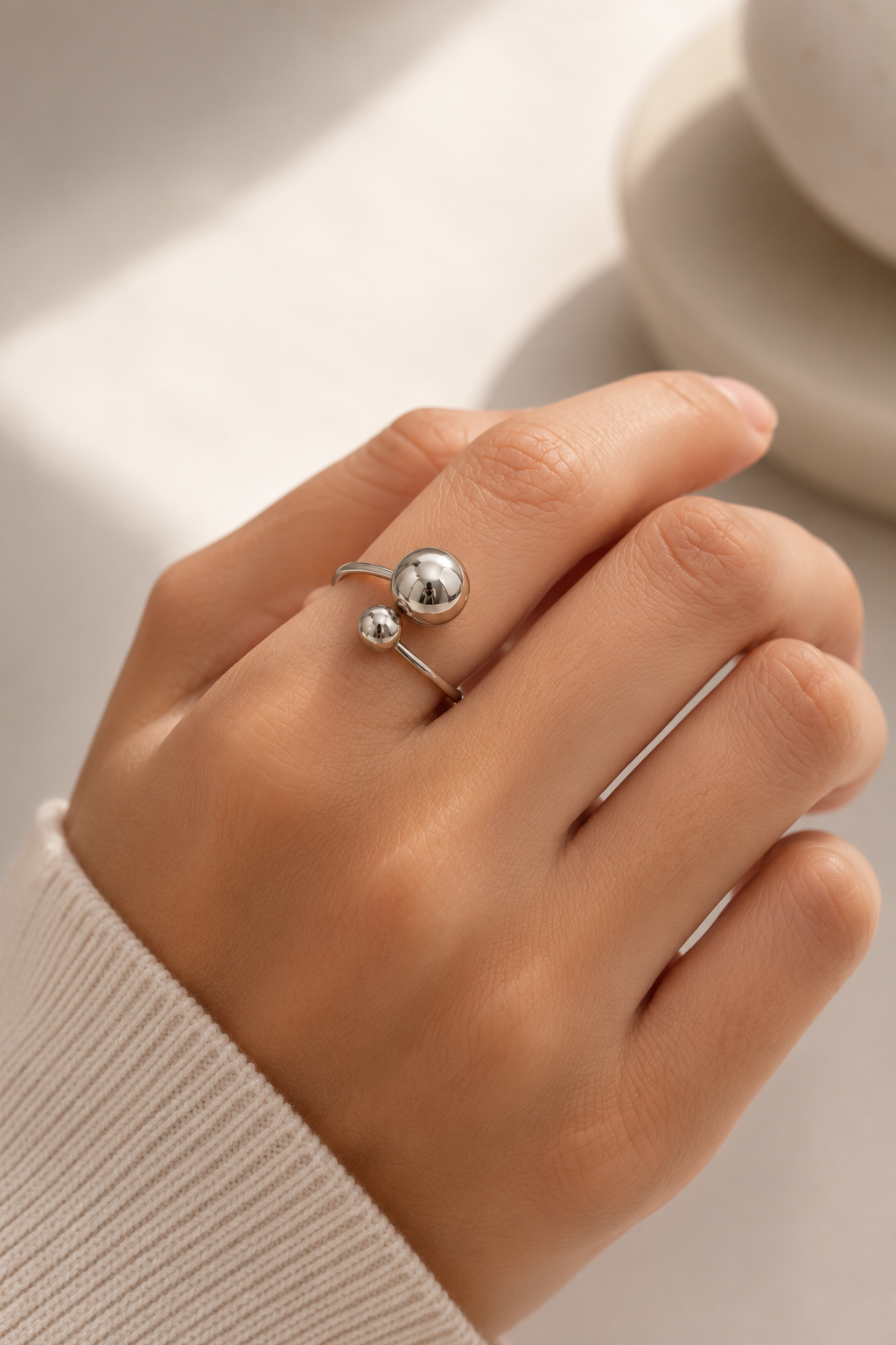 Sleek open-ended silver ball ring