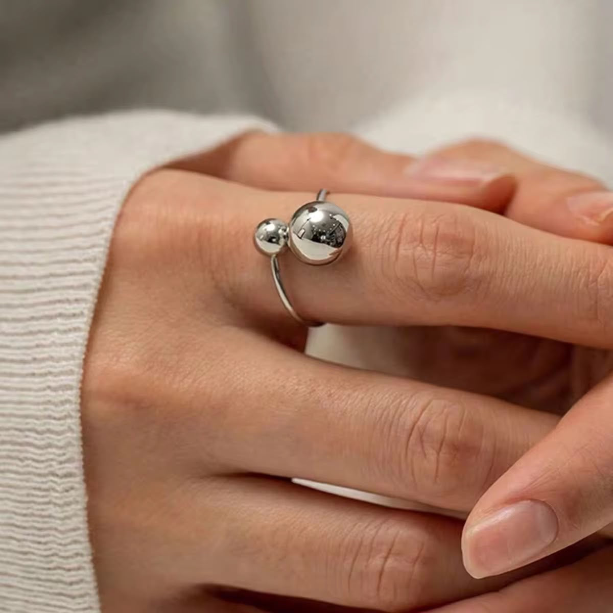Sleek open-ended silver ball ring